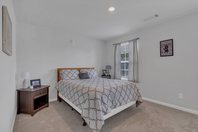 carpeted bedroom featuring recessed lighting, baseboards, and visible vents