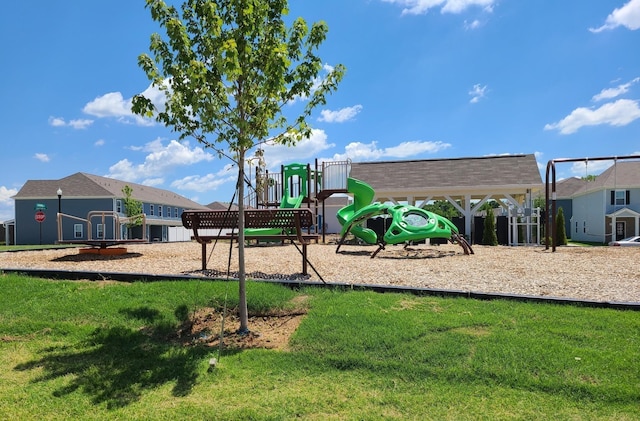 community jungle gym featuring a yard
