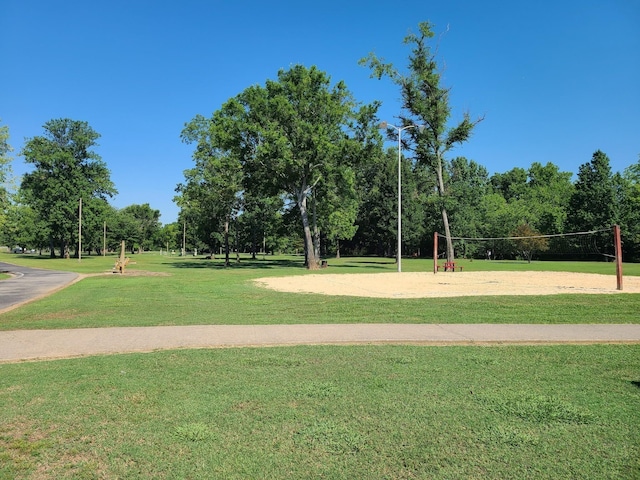surrounding community featuring volleyball court and a yard