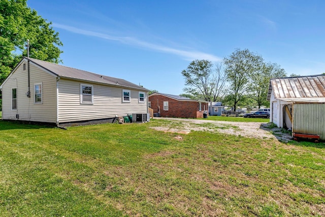 307 Franklin St, Cowan, TN 37318 - view of grassy yard featuring central AC