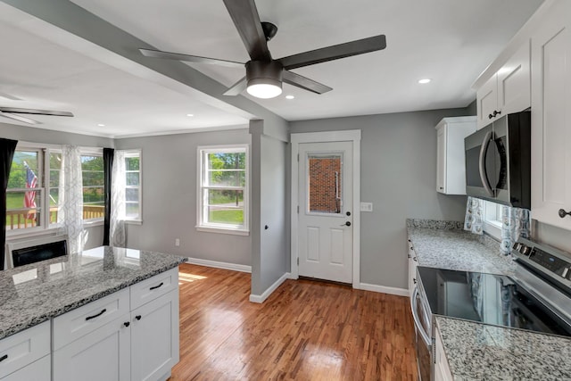 307 Franklin St, Cowan, TN 37318 - kitchen featuring stainless steel appliances, ceiling fan, baseboards, light wood-type flooring, and recessed lighting