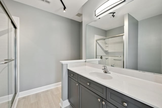 8231 Lenox Creekside Dr Unit C7, Antioch, TN 37013 - bathroom featuring a shower stall, vanity, and baseboards