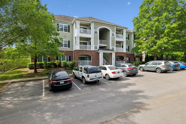 8231 Lenox Creekside Dr Unit C7, Antioch, TN 37013 - view of building exterior featuring uncovered parking