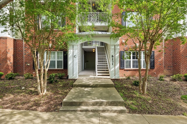 8231 Lenox Creekside Dr Unit C7, Antioch, TN 37013 - view of front facade featuring stairs and brick siding