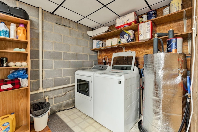 286 Pine Grove Rd, South Pittsburg, TN 37380 - laundry room featuring concrete block wall, light floors, laundry area, and washer and clothes dryer