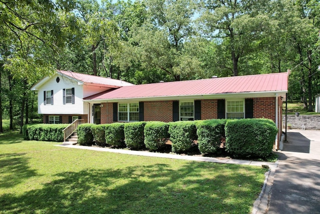 286 Pine Grove Rd, South Pittsburg, TN 37380 - split level home featuring covered porch, a front yard, metal roof, and brick siding