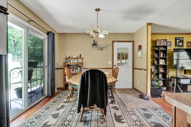 286 Pine Grove Rd, South Pittsburg, TN 37380 - dining room with an inviting chandelier, baseboards, and light wood-style floors