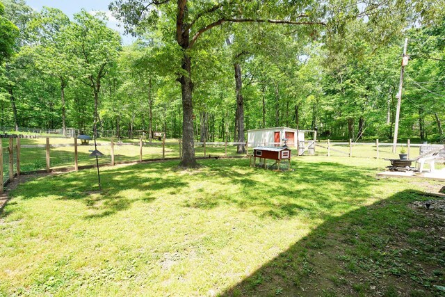 286 Pine Grove Rd, South Pittsburg, TN 37380 - view of yard featuring fence, exterior structure, and an outbuilding