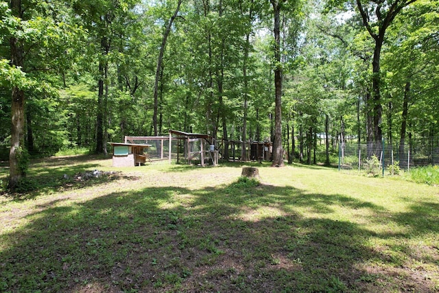 286 Pine Grove Rd, South Pittsburg, TN 37380 - view of yard with a view of trees, exterior structure, fence, and an outbuilding