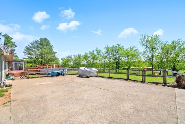 view of car parking with fence