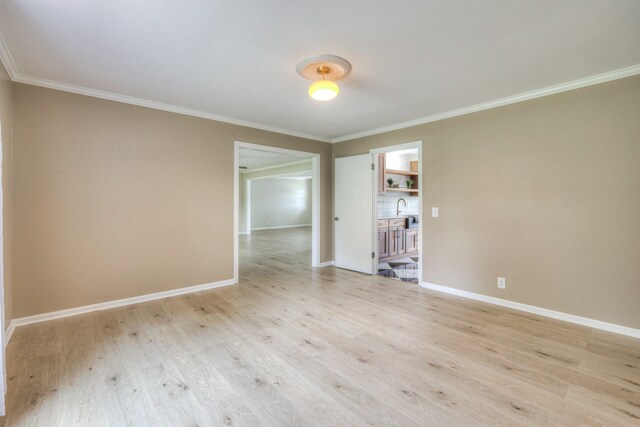 411 Willow Lake Dr, Portland, TN 37148 - spare room with crown molding, baseboards, and light wood-type flooring