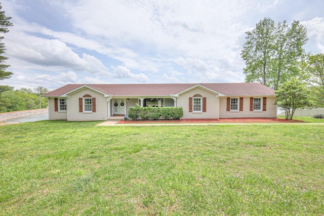 411 Willow Lake Dr, Portland, TN 37148 - ranch-style home featuring covered porch, a front yard, and brick siding