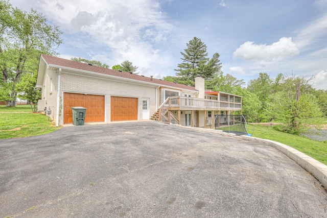 411 Willow Lake Dr, Portland, TN 37148 - view of front of property featuring a chimney, a front yard, a deck, stairway, and brick siding