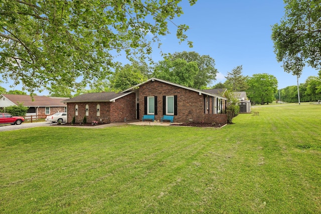 1031 Bayview Dr, Gallatin, TN 37066 - ranch-style house featuring brick siding and a front yard