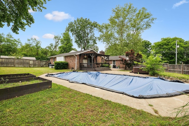 1031 Bayview Dr, Gallatin, TN 37066 - view of swimming pool featuring a fenced in pool, a fenced backyard, and a vegetable garden