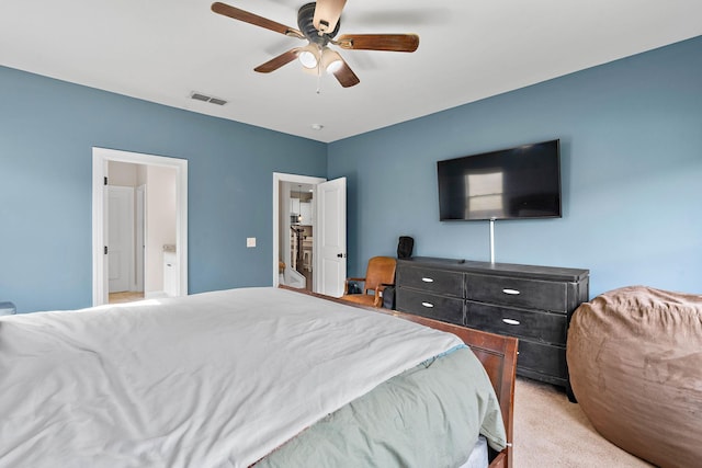 bedroom featuring light colored carpet, a ceiling fan, and visible vents