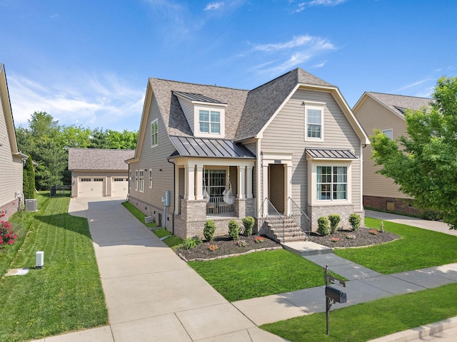 craftsman-style house with a standing seam roof, covered porch, a front yard, and brick siding