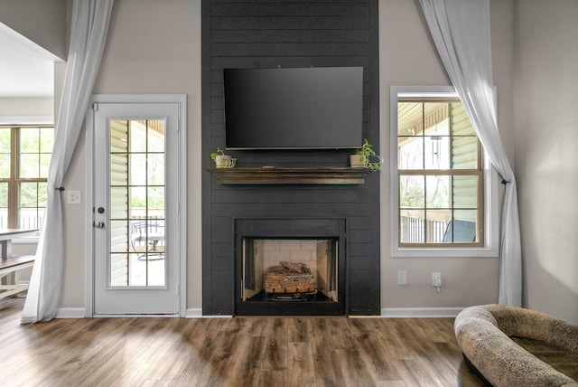 757 Tidwell Dr, Clarksville, TN 37042 - living room with a large fireplace, baseboards, and wood finished floors