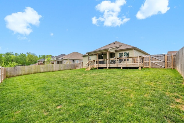 757 Tidwell Dr, Clarksville, TN 37042 - rear view of property featuring roof with shingles, a wooden deck, ceiling fan, a fenced backyard, and a yard
