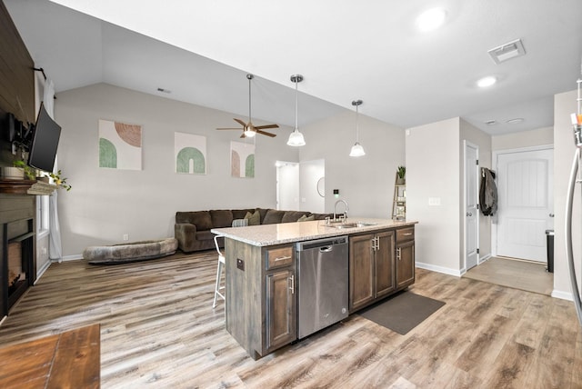 757 Tidwell Dr, Clarksville, TN 37042 - kitchen with stainless steel dishwasher, a sink, lofted ceiling, light wood-style floors, and open floor plan