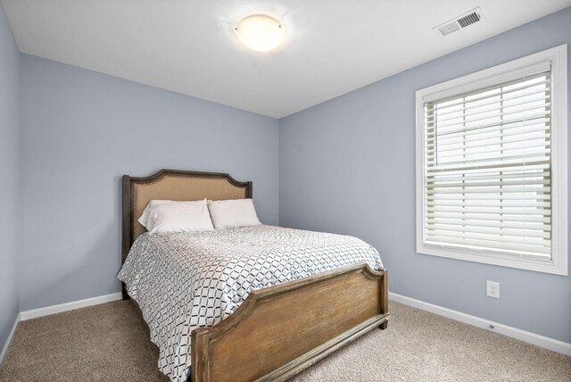 757 Tidwell Dr, Clarksville, TN 37042 - bedroom with visible vents, carpet flooring, and baseboards