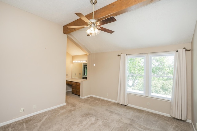 unfurnished room featuring baseboards, light colored carpet, plenty of natural light, and a ceiling fan