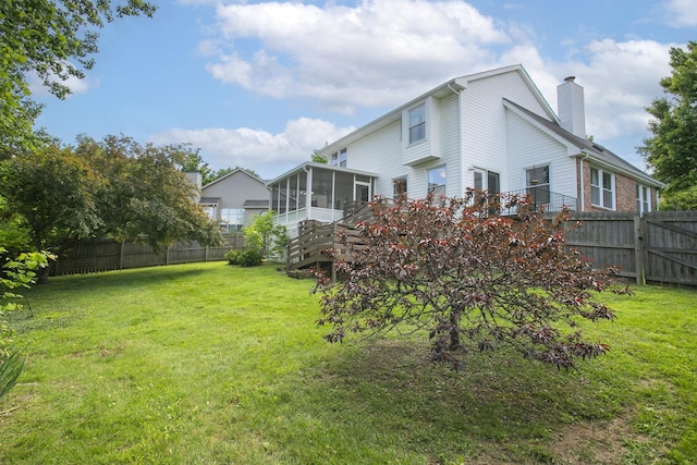 view of yard with a sunroom