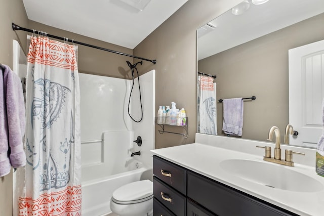 full bath featuring vanity, toilet, and shower / tub combo