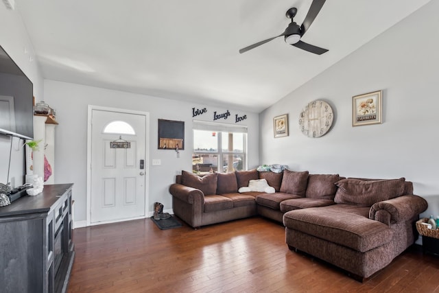 living room with ceiling fan, vaulted ceiling, and dark wood-style floors