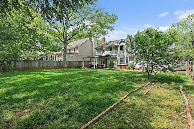 view of yard featuring a fenced backyard and a patio