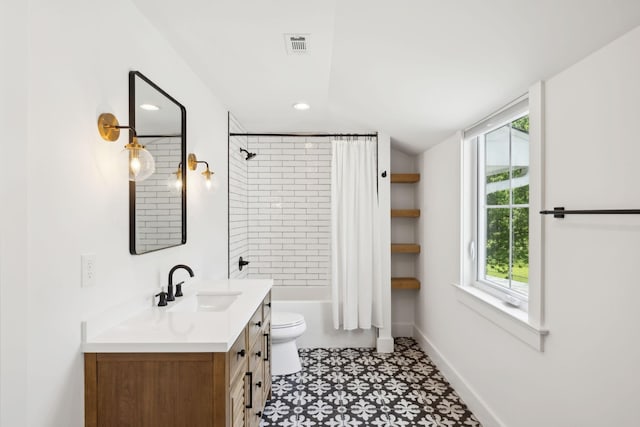 full bath with shower / bath combination with curtain, visible vents, vanity, baseboards, and toilet