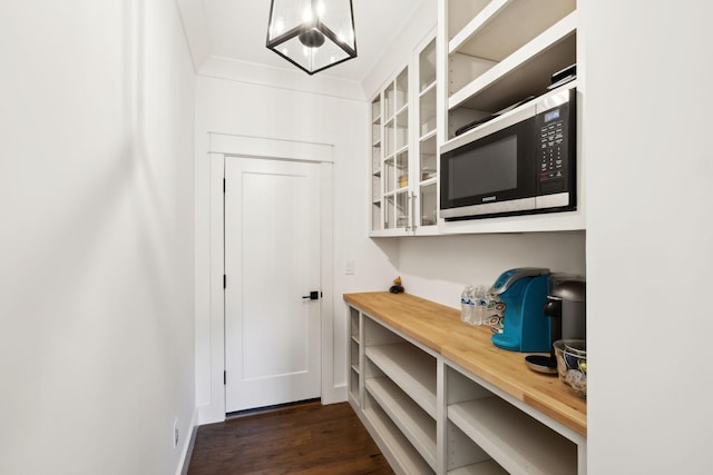 mudroom featuring dark wood finished floors