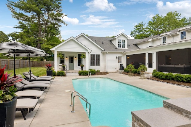 view of pool featuring fence, a fenced in pool, and a patio