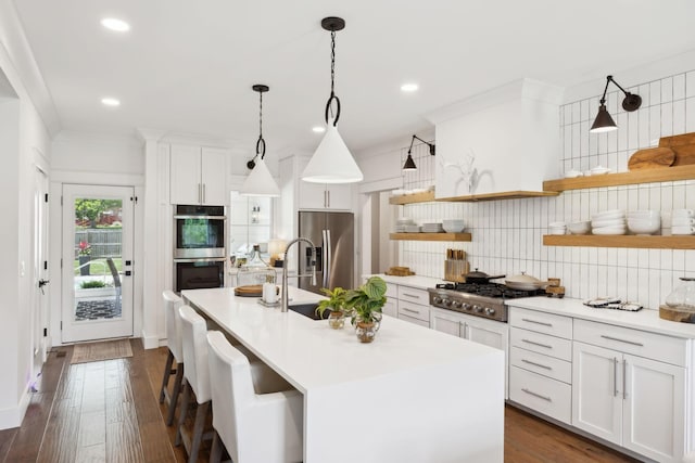 kitchen featuring tasteful backsplash, open shelves, a sink, stainless steel appliances, and white cabinetry