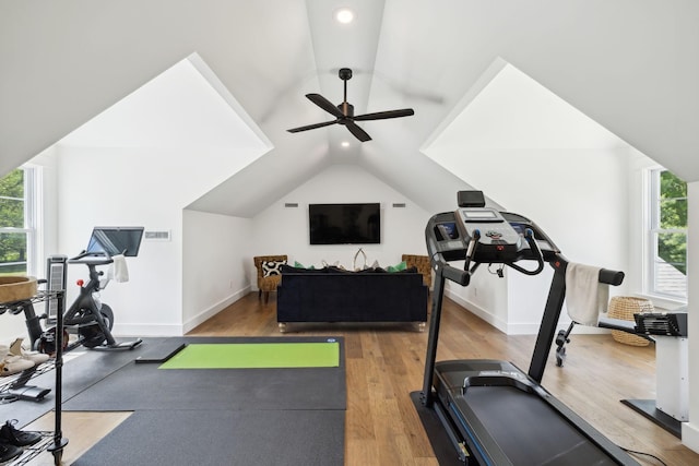 exercise area with lofted ceiling, wood finished floors, baseboards, ceiling fan, and recessed lighting