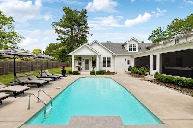 view of swimming pool with fence, a fenced in pool, a patio, and entry steps