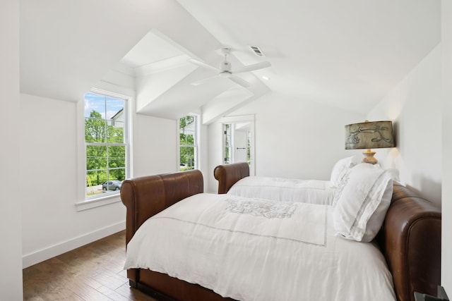 bedroom with ceiling fan, baseboards, wood finished floors, lofted ceiling, and visible vents