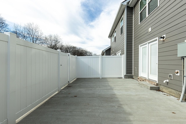 view of patio / terrace featuring fence