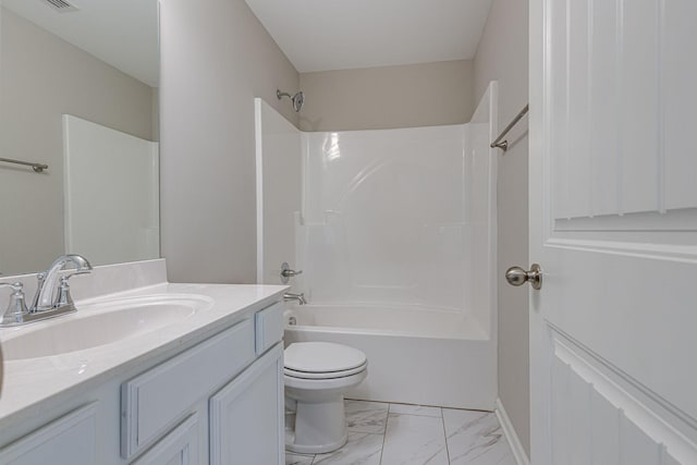 full bathroom with vanity, marble finish floor, toilet, and shower / washtub combination