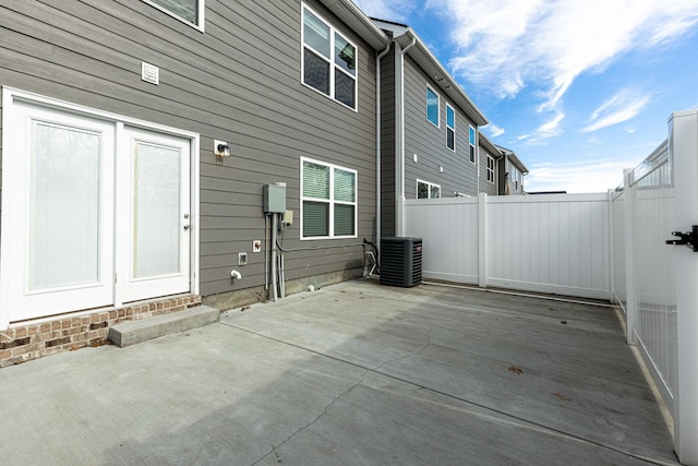 exterior space featuring fence and cooling unit