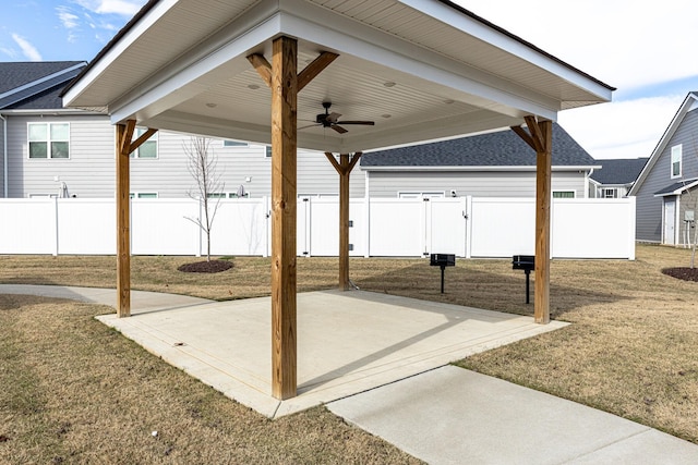view of patio featuring fence and ceiling fan