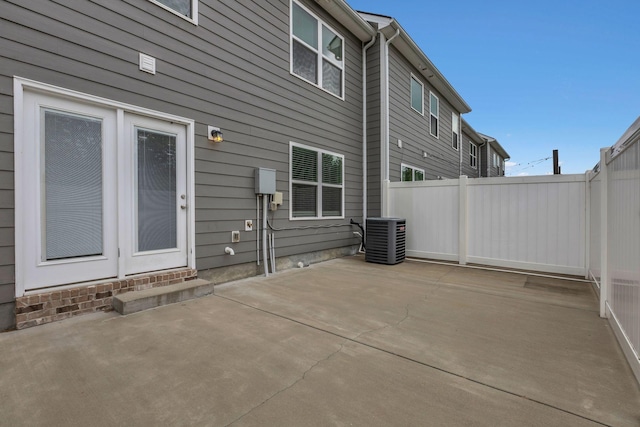 312 Mattie Ln, Spring Hill, TN 37174 - back of property with central AC unit, fence, and a patio area
