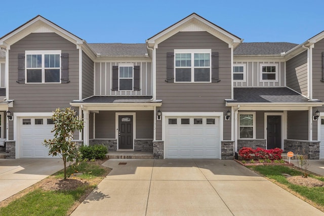 312 Mattie Ln, Spring Hill, TN 37174 - view of front facade with covered porch, concrete driveway, and a garage
