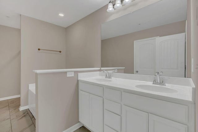 312 Mattie Ln, Spring Hill, TN 37174 - full bath with marble look tiles, double vanity, and baseboards