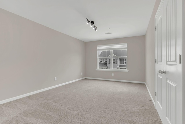 312 Mattie Ln, Spring Hill, TN 37174 - empty room with carpet flooring, track lighting, and baseboards