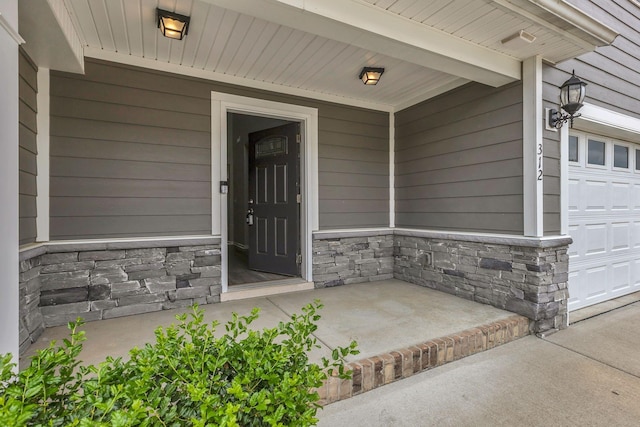 312 Mattie Ln, Spring Hill, TN 37174 - view of exterior entry featuring stone siding and covered porch
