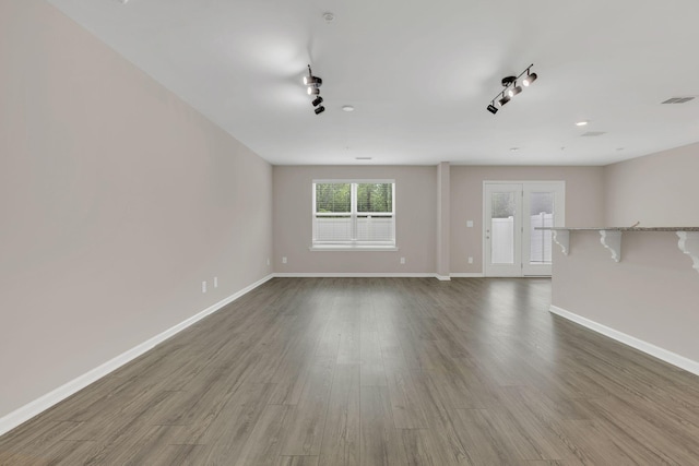 312 Mattie Ln, Spring Hill, TN 37174 - unfurnished living room featuring baseboards and wood finished floors