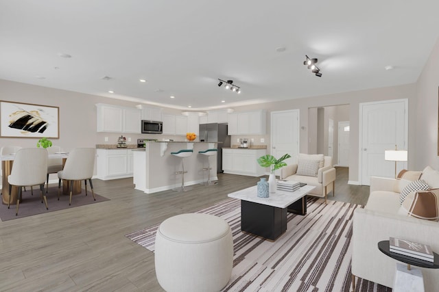 312 Mattie Ln, Spring Hill, TN 37174 - living room featuring light wood-style flooring and recessed lighting