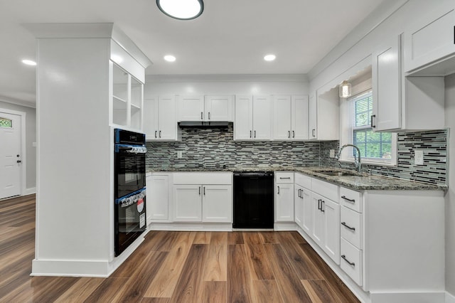 kitchen with open shelves, a sink, black appliances, dark wood-style floors, and stone counters