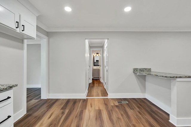 interior space featuring dark wood-style flooring and visible vents